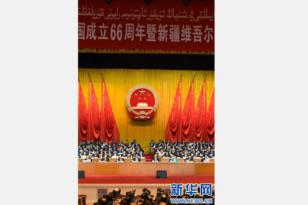 10月1日，慶祝中華人民共和國(guó)成立66周年暨新疆維吾爾自治區(qū)成立60周年大會(huì)在新疆人民會(huì)堂隆重舉行。 新華社記者 高潔 攝 